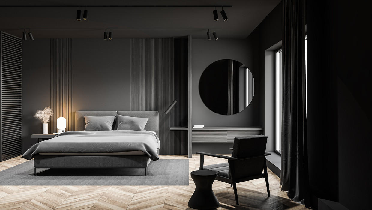 Moderná spálňa, čierna spálňa, tmavošedé doplnky, drevená podlaha, šedý koberec pod posteľ, okrúhle zrkadlo na stene