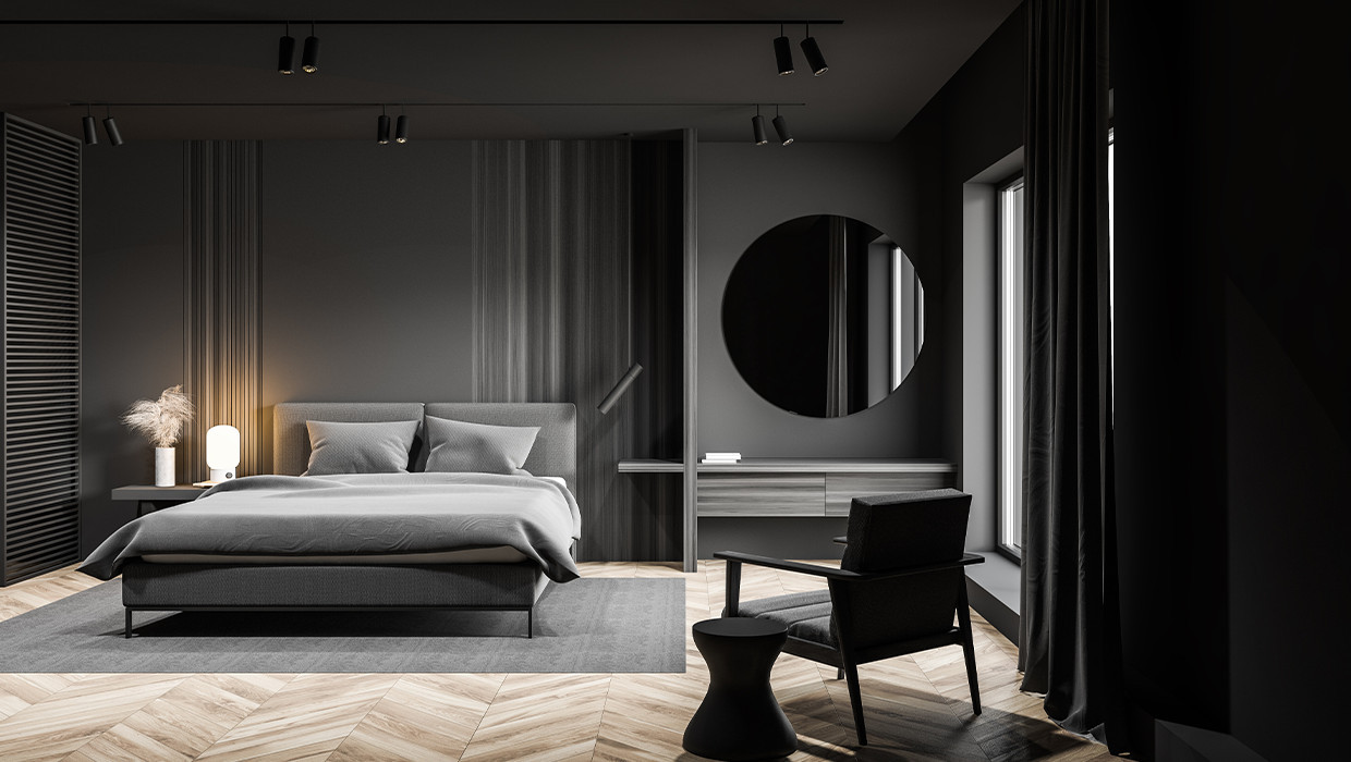 Moderná spálňa, čierna spálňa, tmavošedé doplnky, drevená podlaha, šedý koberec pod posteľ, okrúhle zrkadlo na stene