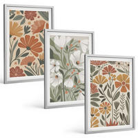 BILDER SET 3er Set - 40x60 cm Silberner Rahmen - Blumenmuster in Orange und Grün - Silberfarben, Kunststoff (40/60cm) - TULUP