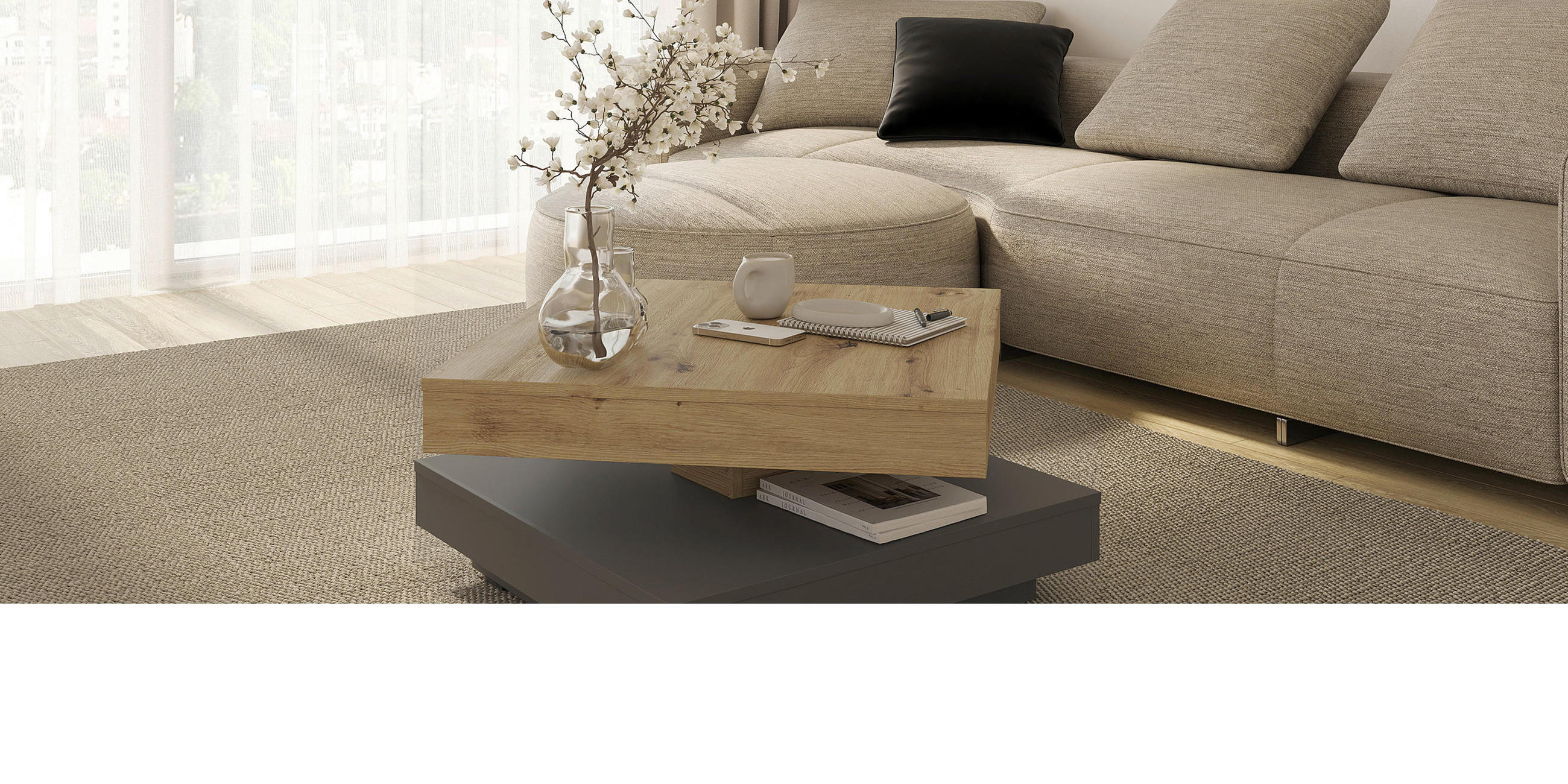 Couchtisch drehbar mit zwei Ebenen in Holzoptik und grauem Fuß vor beiger Couch.