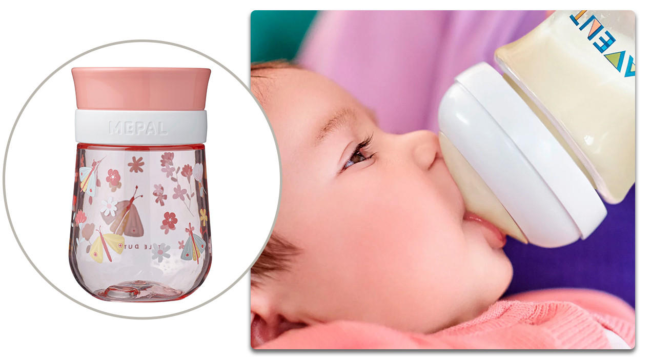 Baby mit Trinkflasche und rosa Kindertrinkflasche