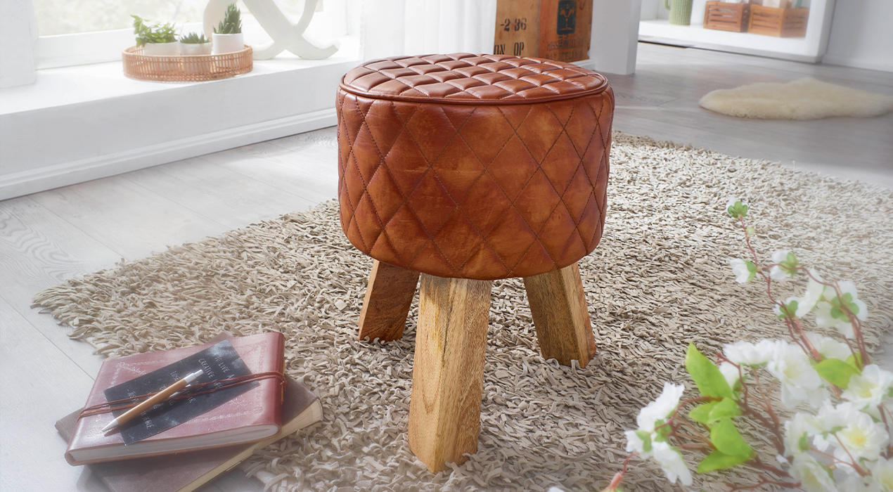 Hocker mit brauner Echtleder Sitzfläche.jpg