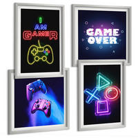 BILDER SET 4er Set - 50x50 cm & 40x60 cm Silberner Rahmen - Gamepads, Spielersymbol-Untertitel - Silberfarben, Kunststoff (50/50cm) - TULUP