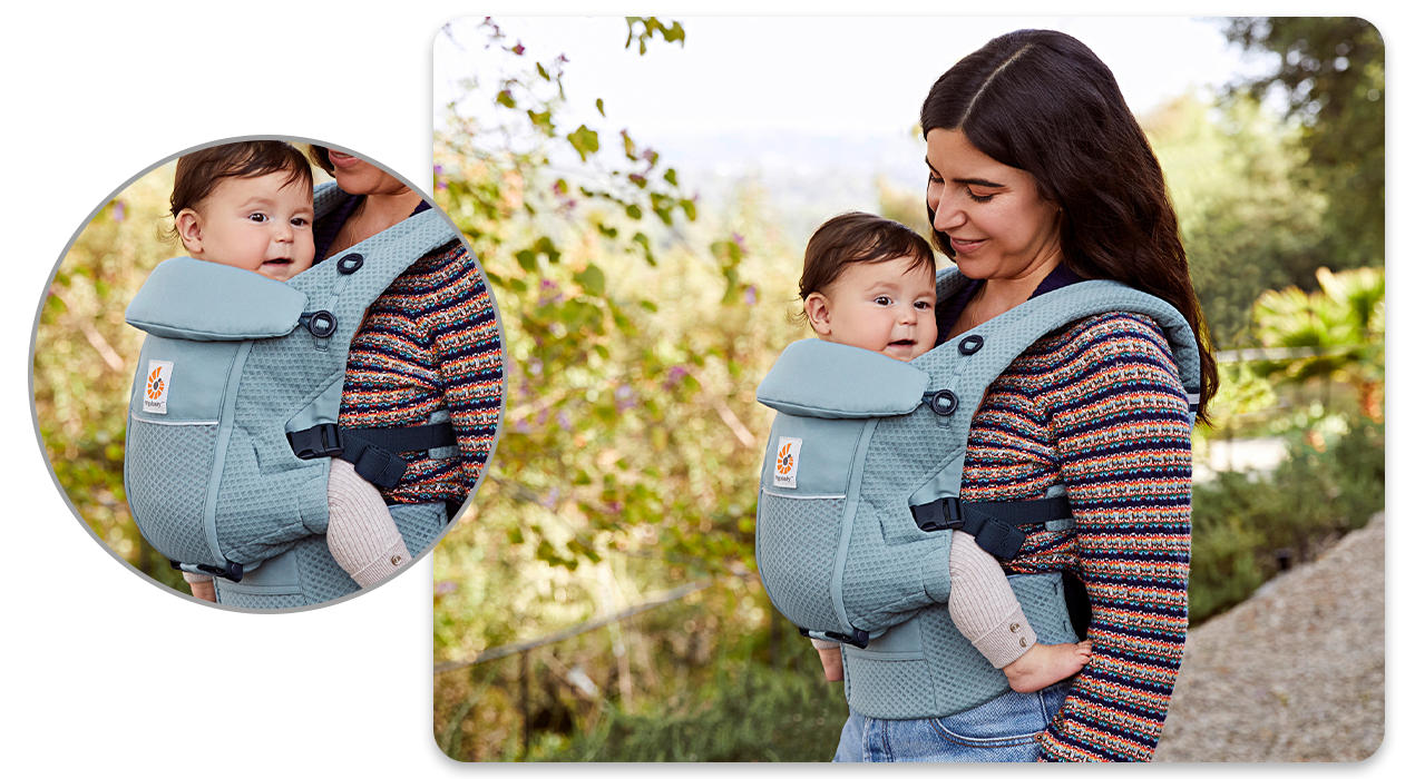 Frau mit Baby in Trage