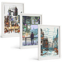 BILDER SET 3er Set - 40x60 cm Weißer Rahmen - Moderne Städte, bunte Charaktere - Weiß, Kunststoff (40/60cm) - TULUP
