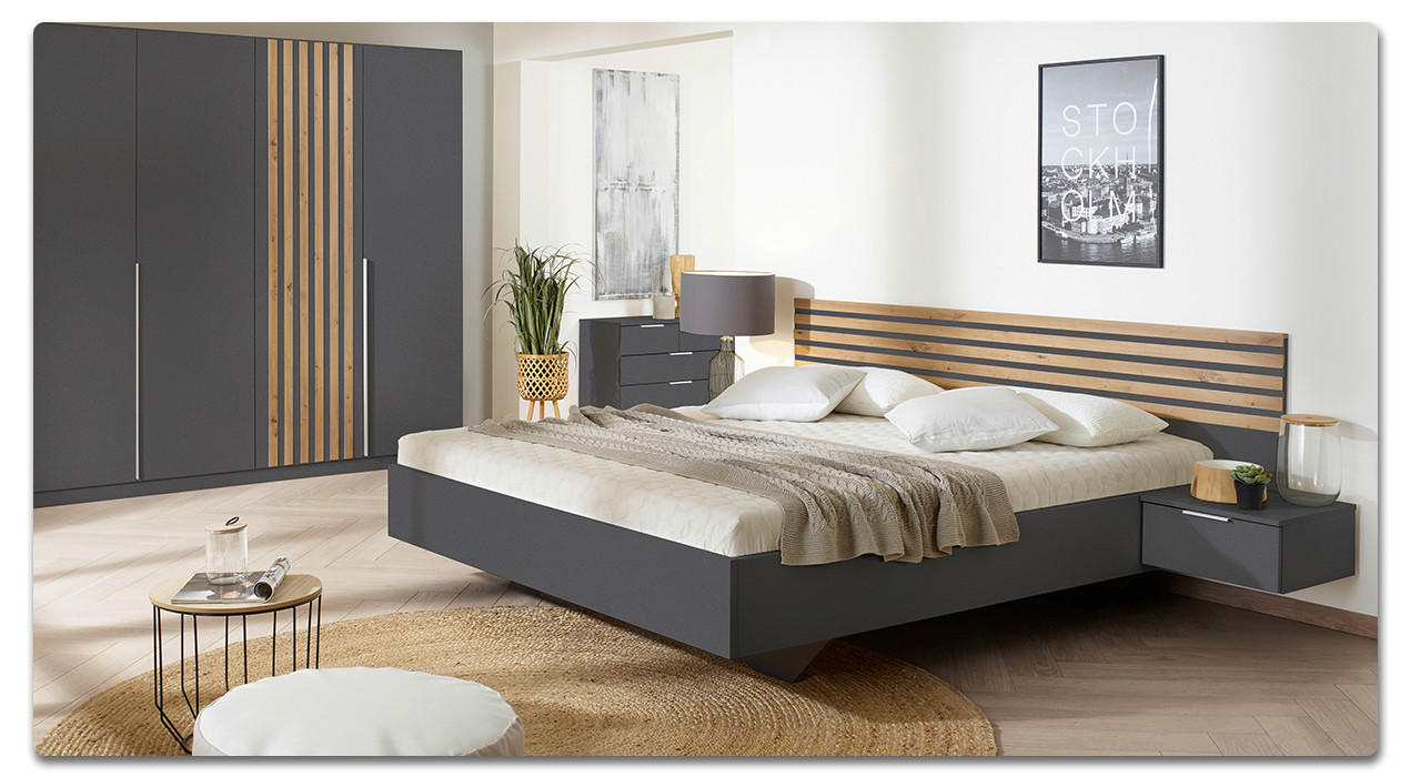 Schlafzimmer in Grau mit natürlichen Einflüssen durch Holz und Pflanzen
