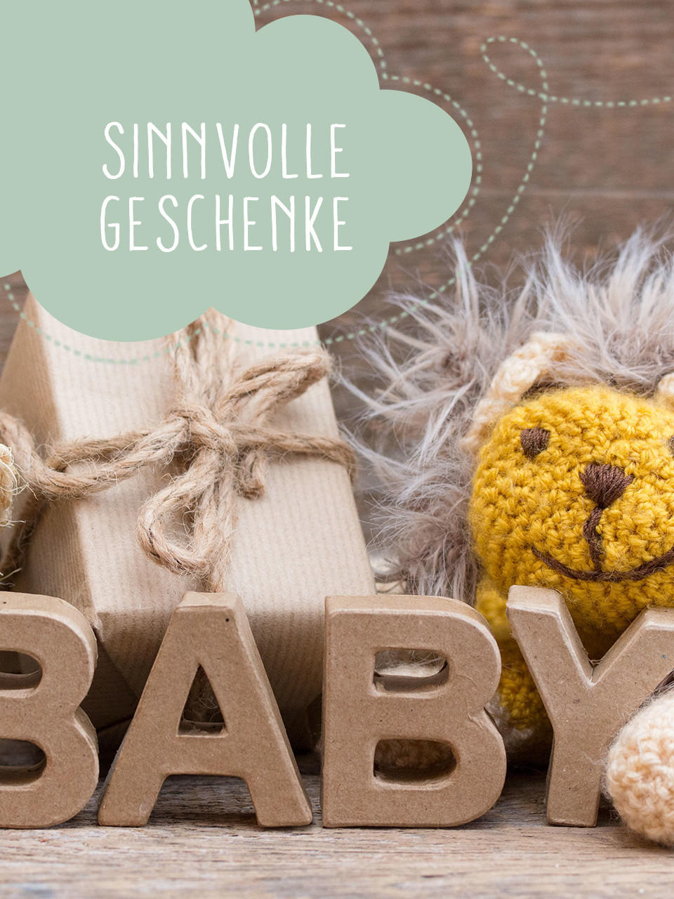 Babyschriftzug in braun mit geschenken