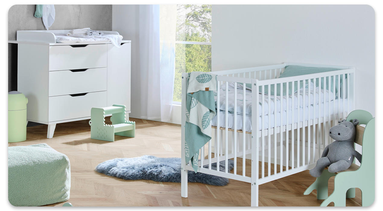 babybett in grün