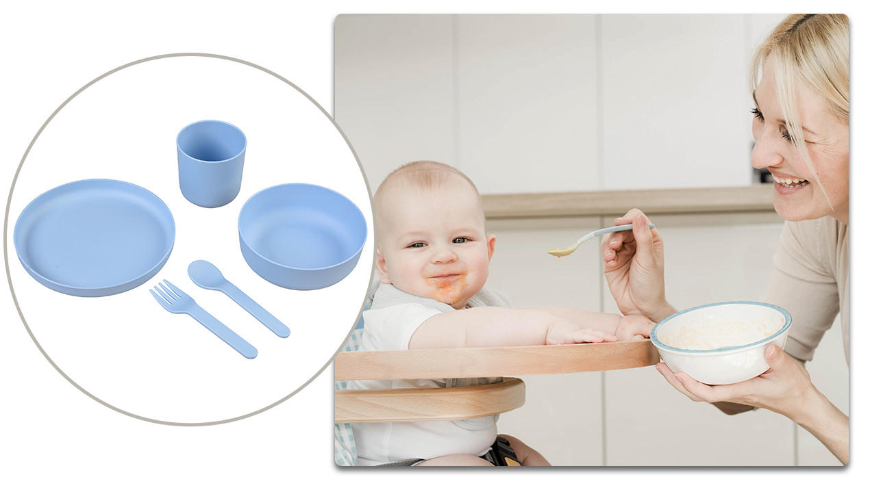 baby wird gefüttert und blaues Kindergeschirr