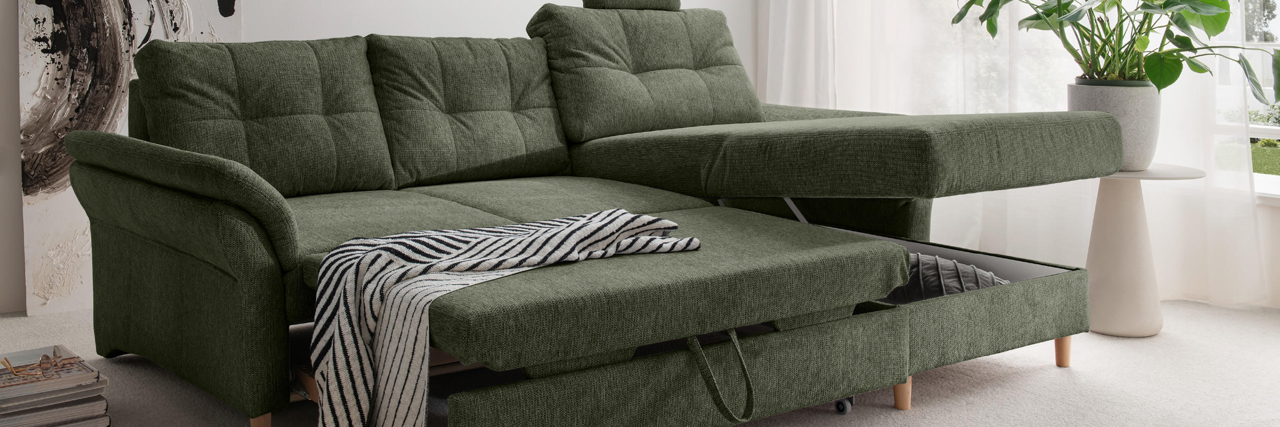 grüne moderne Couch zum Ausziehen mit Stauraum