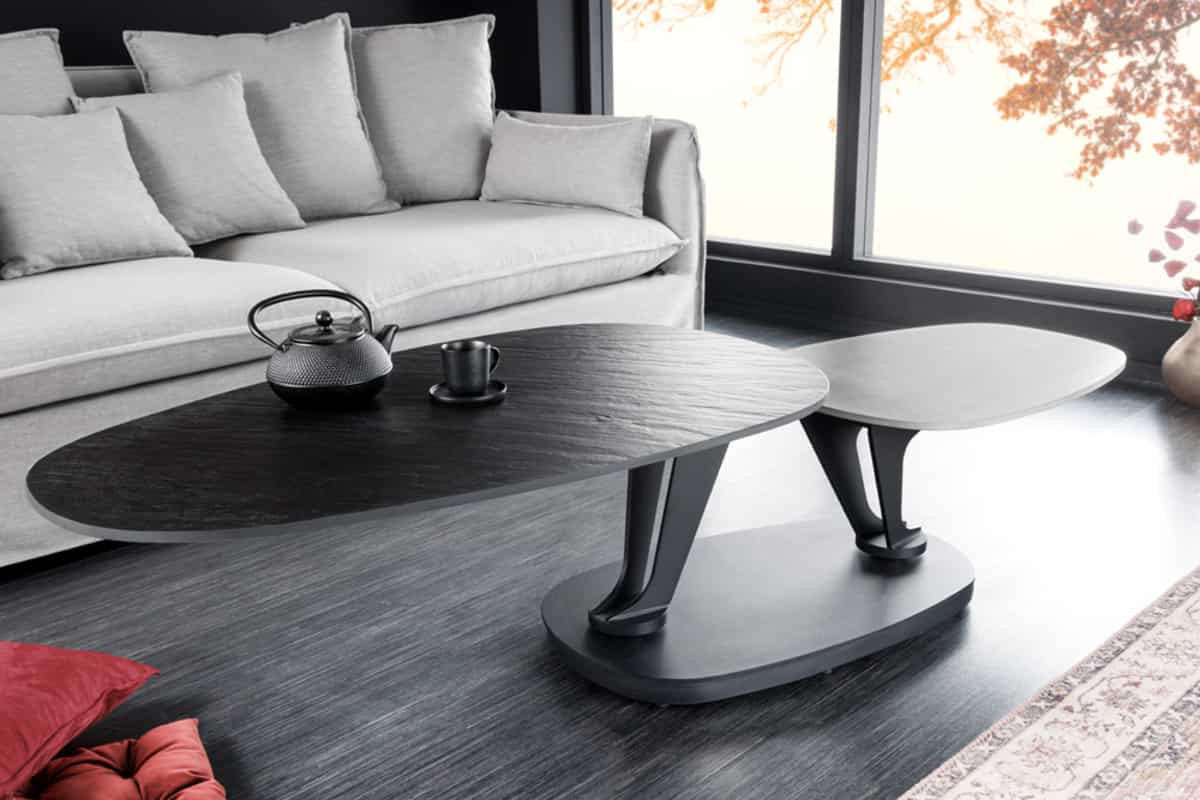 COUCHTISCH MOVEMENT Beton rund Grau|Schwarz 160cm - Goldfarben/Schwarz, Naturmaterialien/Keramik (110/160/40cm) - riess-ambiente