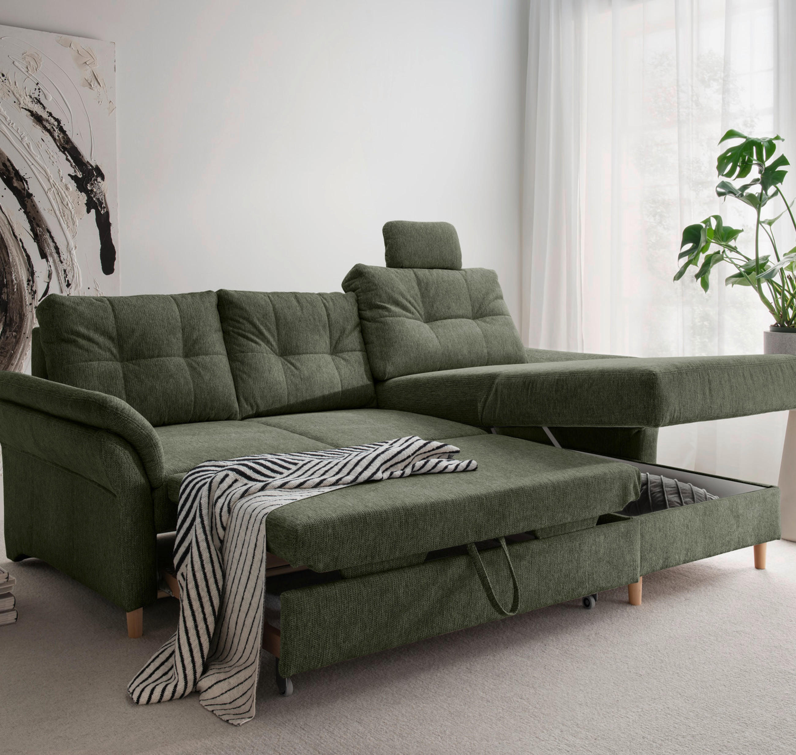 Ausziehbares grünes Sofa mit Stauraumfunktion