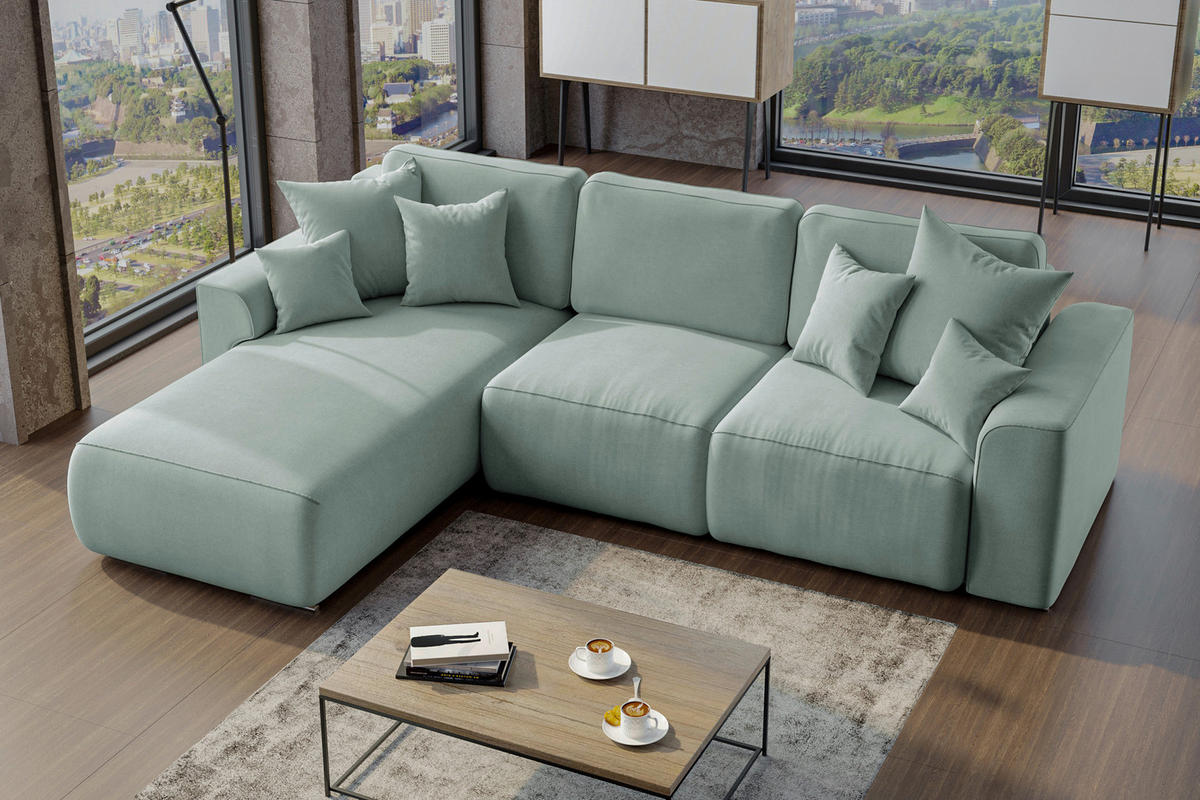 Carryhome ECKSOFA Mintgrün Velours, links davon: Hochflorteppich, rechts davon: Couchtisch, Bild in schwarz, Lektüre in hellem Wohnzimmer.