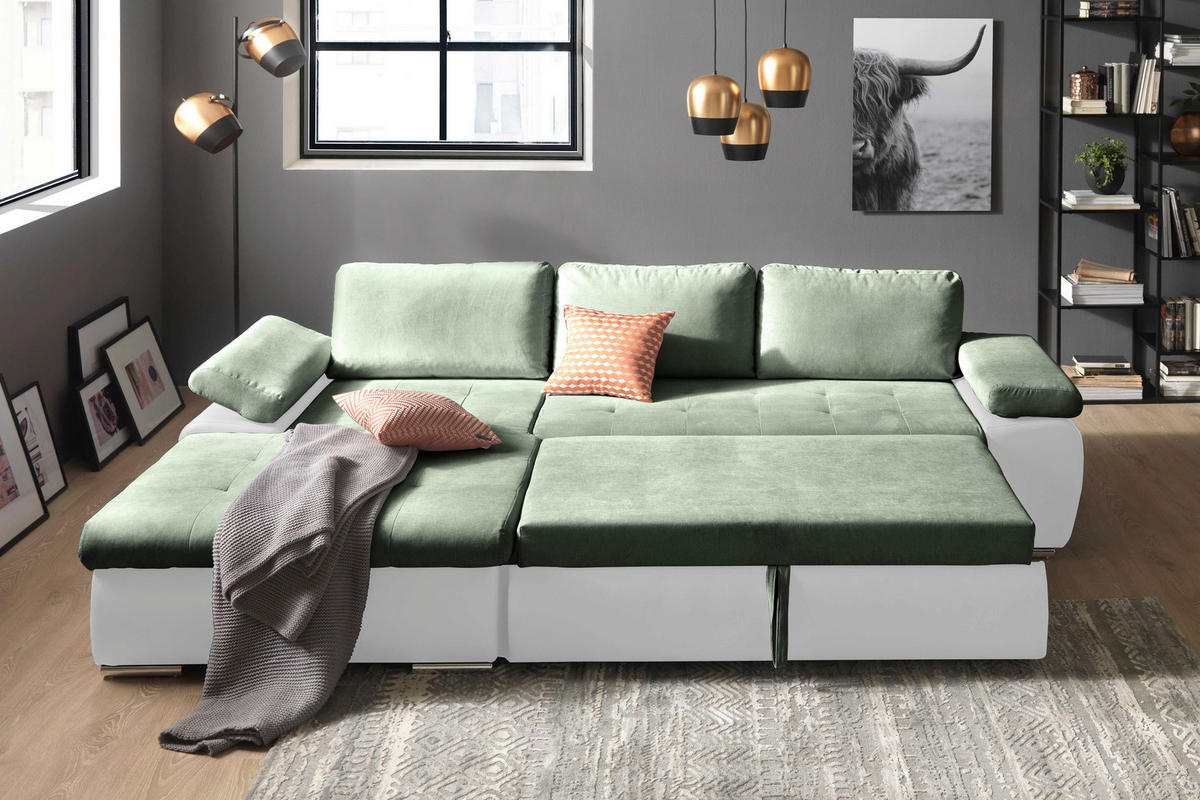 MID.YOU ECKSOFA Weiß, Olivgrün Flachgewebe, links davon: Decke, Bild, rechts davon: Regal in schwarz, Deckenbeleuchtung in hellem Wohnzimmer.