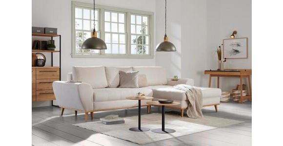 Carryhome ECKSOFA Schwarz Webstoff, rechts davon: Hochflorteppich, Beistelltisch, Sitzbank, Decke in weiß in hellem Wohn-Esszimmer.