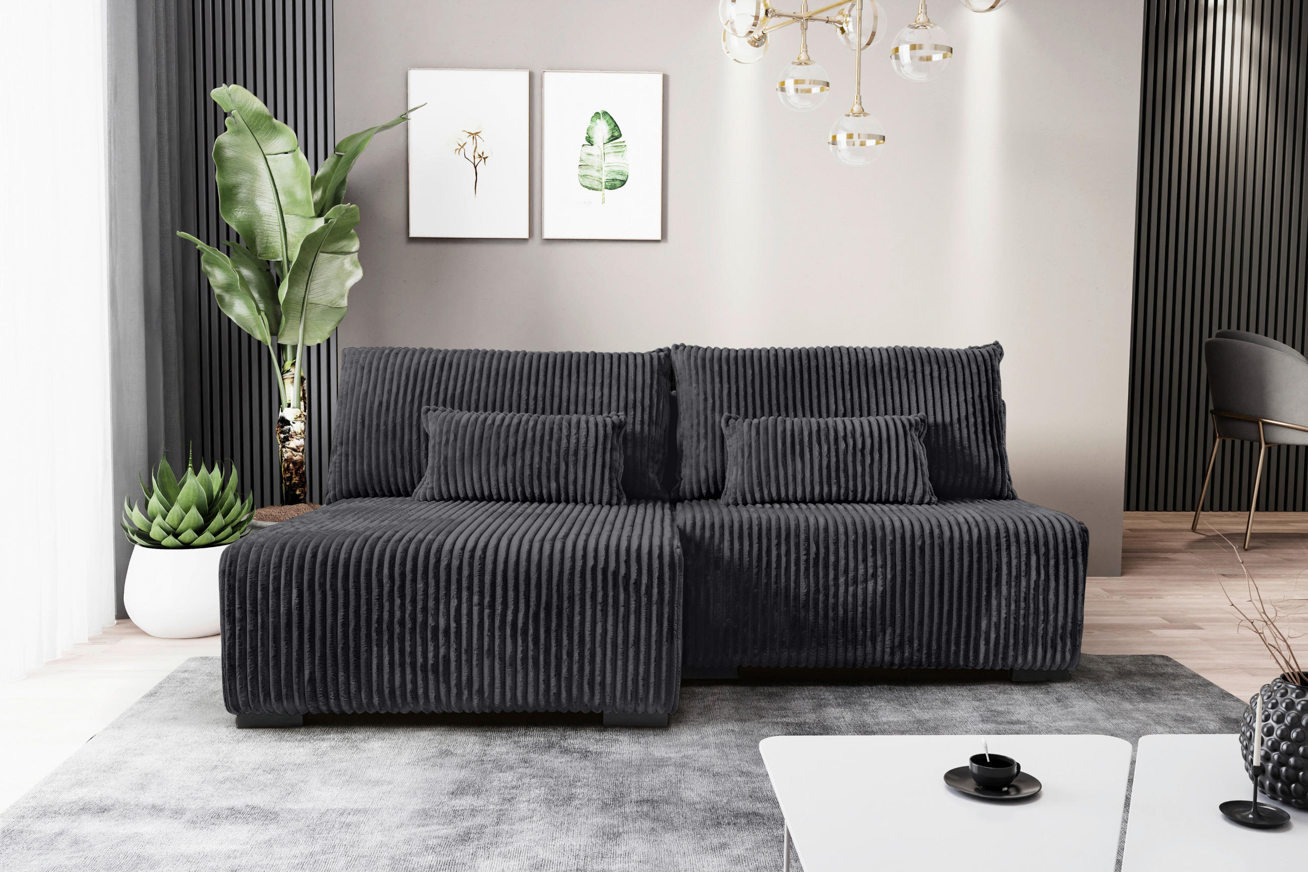 Carryhome ECKSOFA Schwarz Cord, links davon: Hochflorteppich, Topfpflanze in grün, rechts davon: Couchtisch, Bild in weiß in hellem Wohnzimmer.